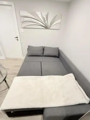 a bedroom with two beds in a room at Modern and Cozy Basement Suite,2 Bedrooms with Kitchen ,Parking and Separate Entrance in Milton
