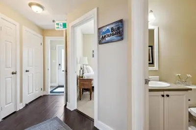a bathroom with a sink and a mirror at 225 Snowbridge with Village Shuttle in Blue Mountains