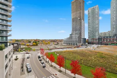 a street in a city with tall buildings at Sleek Sq 1 Downtown Condo - 4 beds - Parking in Mississauga