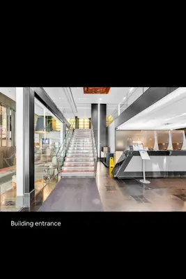 a building entrance with a staircase in a building at The Vicky - Centre of Attention - Location Design in Toronto