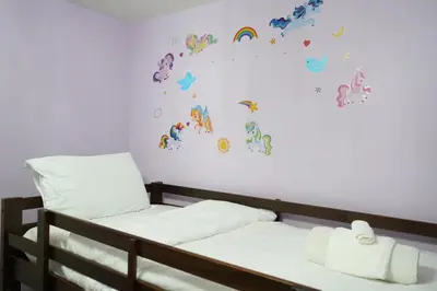 a bedroom with a bed and a wall with butterflies at Luxury 5BR Home with Spa Bath in Burlington
