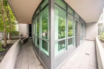 a hallway with glass doors on a building at Private Entrance 2 Bedroom Condo Downtown Toronto in Toronto