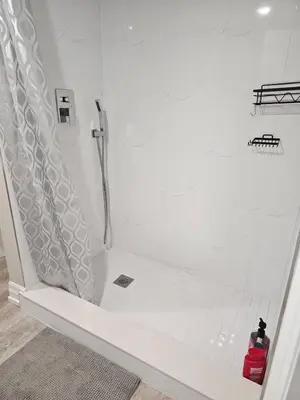 a white shower with a bench in a bathroom at Superb Guest House In Downtown-Self Checkin& Fast Wifi in Toronto