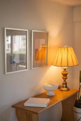 a table with a lamp and a bowl on it at The County Haus - Indoor Pool & Finnish Sauna in West Lake