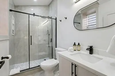 a bathroom with a shower and a toilet and a sink at The Wynford Romantic Amalfi Escape in Elora