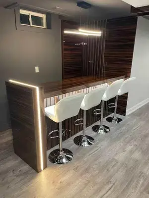 a bar with white bar stools in a room at Navigate Stays Canada Luxury Hot Tub Retreat Home in Richmond Hill
