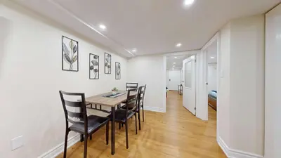 a dining room with a table and chairs at Cozy Basement Apartment for 4 - Near Cafes & Parks in Toronto