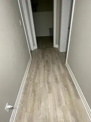 an empty hallway with a wooden floor in a house at DOWNTOWN STAY-Free Wifi&Self Checkin in Toronto