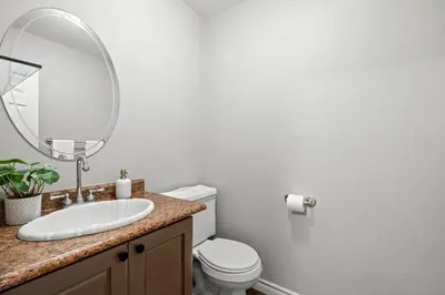a bathroom with a sink and a mirror at 16 Guests Huge Spacious Home Near Ski Resorts in Barrie