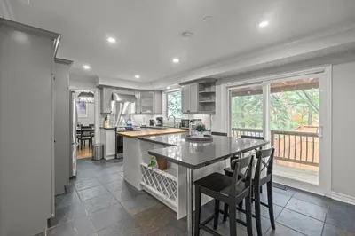 a kitchen with a large island with a counter top at 16 Guests Huge Spacious Home Near Ski Resorts in Barrie