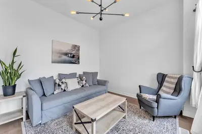 a living room with a couch and two chairs at Spacious & New Prince Edward County Villa in Carrying Place