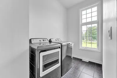 a kitchen with a stove and a window at Spacious & New Prince Edward County Villa in Carrying Place