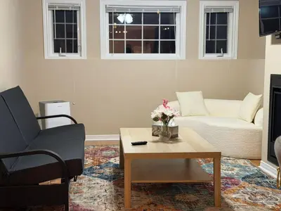 a living room with a couch and a coffee table at Cozy Private Basement Apartment in Fort Erie in Fort Erie