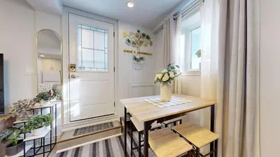 a small dining room with a table and a window at New Bright 1BR Basement Suite in York in Toronto