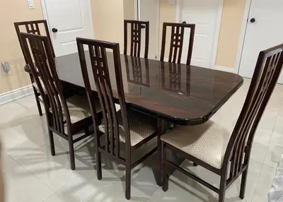 a dining room table and chairs with a glass table and four chairs at Landen court in Mississauga