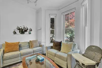 a living room with couches and a coffee table at Spacious 1 bed 1 bath Apt Close to Downtown and Beach in Cobourg