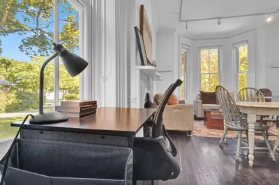 a living room with a table and a dining room at Spacious 1 bed 1 bath Apt Close to Downtown and Beach in Cobourg