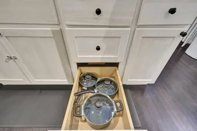 a washing machine in a drawer in a kitchen at Spacious 1 bed 1 bath Apt Close to Downtown and Beach in Cobourg