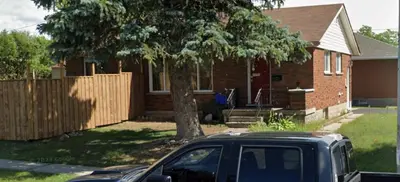 a black car parked in front of a house at Hespeler Haven Hideaway in Cambridge