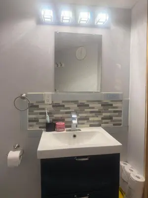 a bathroom with a sink and a mirror at Hespeler Haven Hideaway in Cambridge