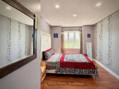 a bedroom with a bed and a window at 3409 McDowell Drive Mississauga Ontario L5M6R7 in Mississauga