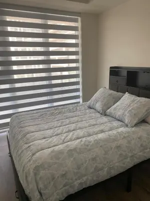 a bedroom with a large bed in front of a window at Modern Private Room with Ensuite in Vaughan