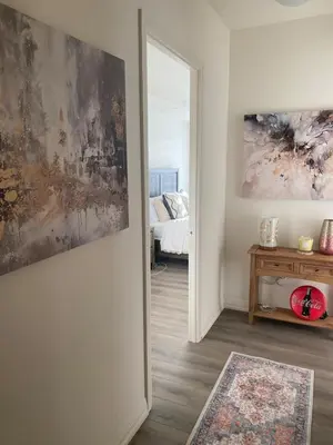 a living room with a door leading to a bedroom at Modern Private Room with Ensuite in Vaughan