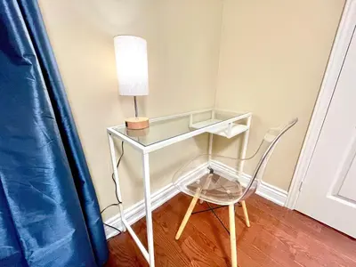 a glass table with a lamp and a chair at Maison Laurier, Modern 5B4B Home Inc BSMT Free parking, Close to trails in Richmond Hill