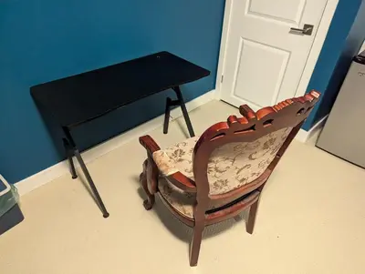 a wooden chair and a table in a room at Sunshine room on Downsview in Toronto