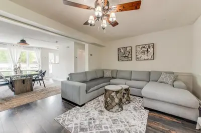 a living room with a couch and a table at 3 BDR lake Simcoe cottage-free parking -day pass to provincial park-one hour from Toronto in Georgina