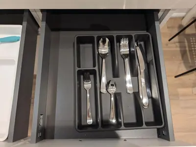 a black tray with utensils in a drawer at Luxury 1BR plus den walkout basement in Toronto