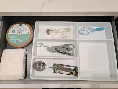a drawer full of kitchen utensils in a box at Luxury 1BR plus den walkout basement in Toronto