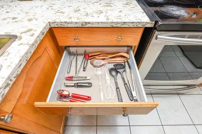 a drawer in a kitchen with utensils in it at Entire 4BR 3BA Home in Mississauga, Sleeps 8, 10 mins to Pearson Airport in Mississauga