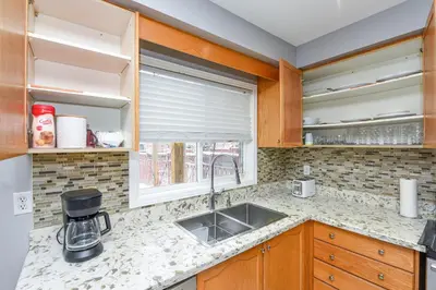 a kitchen with a sink and a window at Entire 4BR 3BA Home in Mississauga, Sleeps 8, 10 mins to Pearson Airport in Mississauga