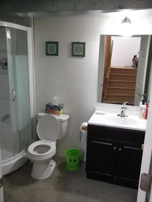 a bathroom with a toilet and a sink and a shower at Lakeshore North - Waterloo, Ontario in Waterloo