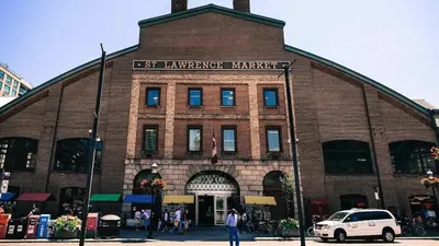 a large brick building with a sign on it at Cozy & Elegant Condo-Lake & City View-35th floor in Toronto