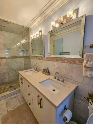 a bathroom with two sinks and a large mirror at Ensuite in New Home with Parking, Close to Bluffers Park, Lake Ontario, 15 Mins to Downtown in Toronto