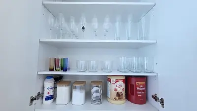 a refrigerator filled with lots of glasses and other items at Nordic Three Brantford in Brantford
