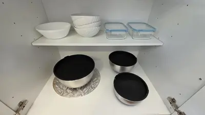 a shelf with three bowls and bowls on it at Nordic Three Brantford in Brantford