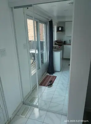 a view of a room with a mirror on the floor at Midtown Toronto studio in Toronto