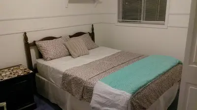 a bedroom with a bed in a room with a window at HB Guest Home 3 in Waterloo