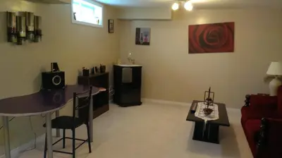 a living room with a table and a couch at HB Guest Home 3 in Waterloo