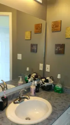 a bathroom counter with a sink and a mirror at HB Guest Home 3 in Waterloo
