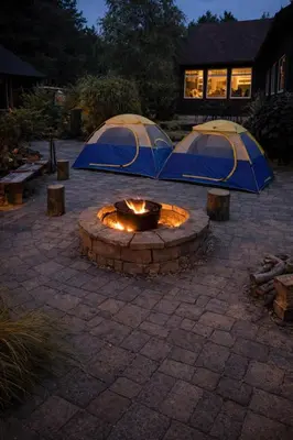 two tents in a courtyard with a fire pit at Peaceful Forest Retreat with Fire Pit and BBQ near Mansfield Ski Club in Mulmur