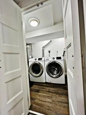 a laundry room with a washer and dryer at Cozy Place in Oshawa