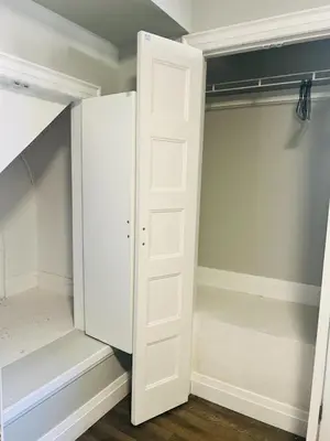 a walk in closet with white doors at Cozy Place in Oshawa