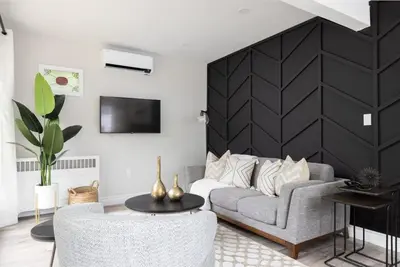 a living room with a couch and a table at New Modern Home in Old Town in Niagara on the Lake