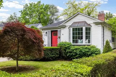 a white house with a red door at New Modern Home in Old Town in Niagara on the Lake
