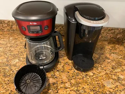 a coffee maker and a blender on a counter at Waterfront Muskoka Cottage on Trent-Severn River in Severn