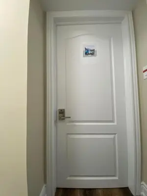 a white door with a picture on it at Relaxing 2 Bedroom Basement Stay in Mississauga